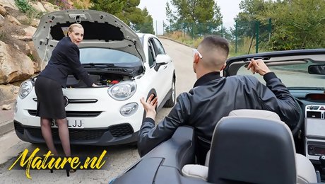Classy Granny Lucia Kury Has Some Trouble With Her Car But Gets Help From A Young Spanish Lad